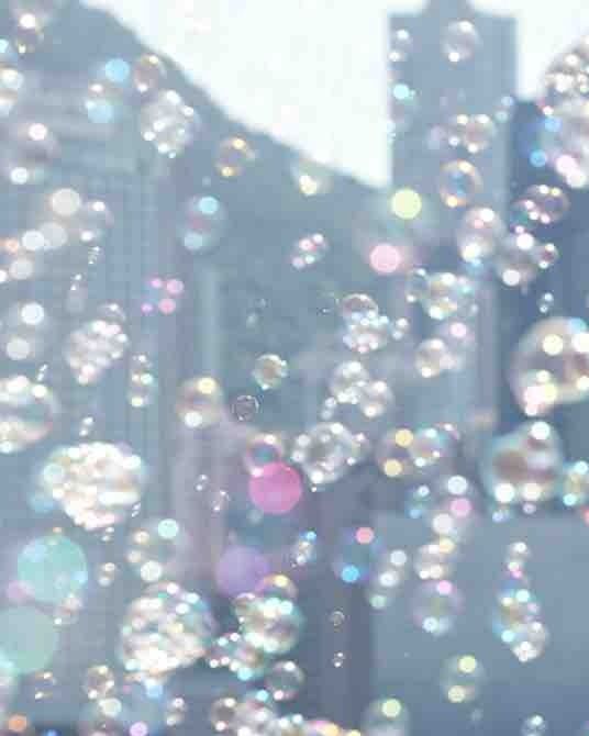 Soap bubbles drifting in front of the Hong Kong skyline